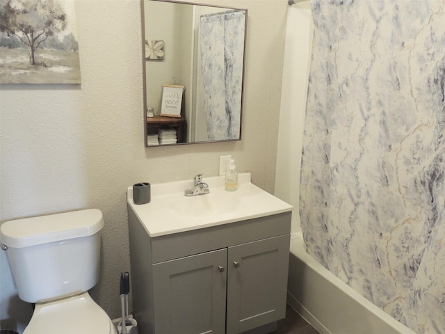 full bathroom featuring vanity, shower / bath combination with curtain, and toilet