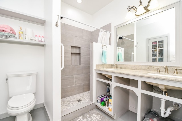 bathroom featuring toilet, sink, and a shower with shower curtain