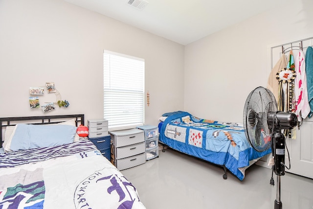 bedroom with concrete flooring