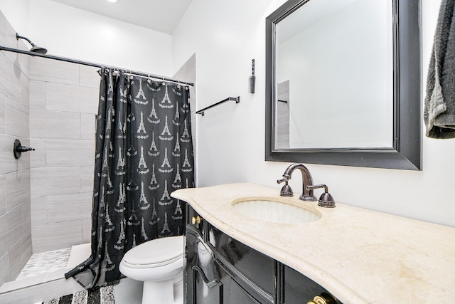 bathroom featuring vanity, toilet, and walk in shower