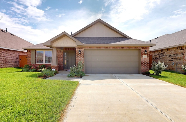 view of front of property featuring a garage and a front lawn