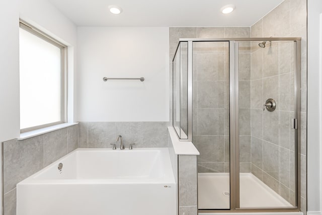 bathroom featuring plus walk in shower