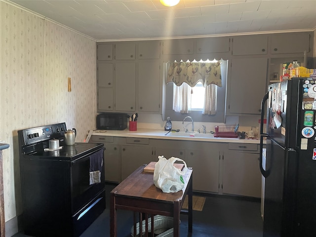 kitchen with sink and black appliances