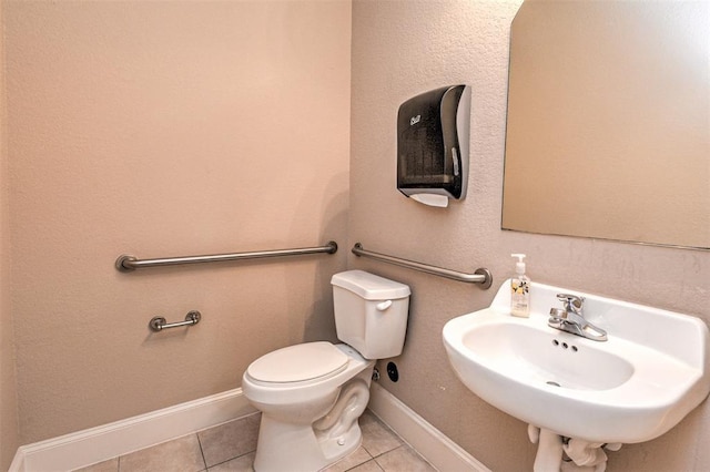 bathroom with tile patterned floors, sink, and toilet