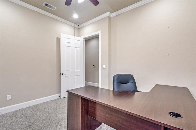 unfurnished office featuring light carpet, ceiling fan, and ornamental molding