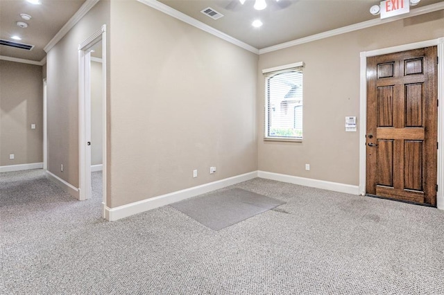 entrance foyer with carpet flooring and crown molding