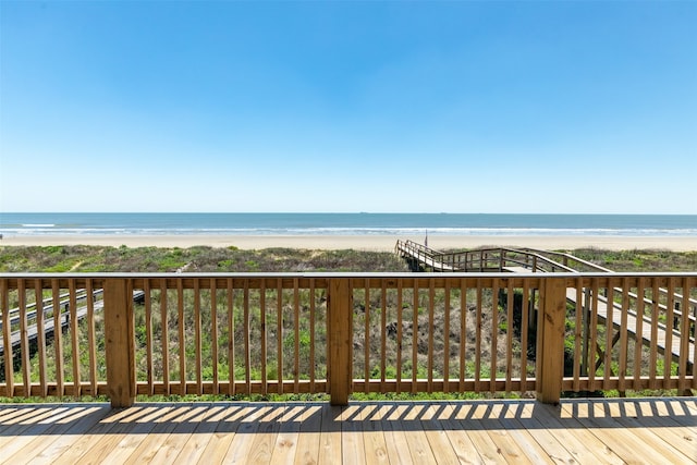 wooden deck featuring a water view