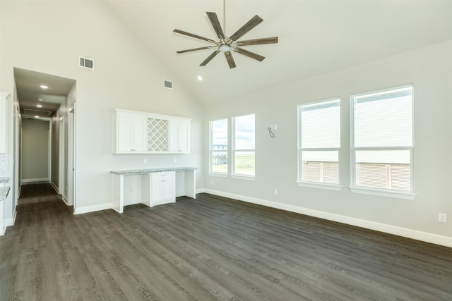 unfurnished living room with ceiling fan, high vaulted ceiling, and dark hardwood / wood-style flooring