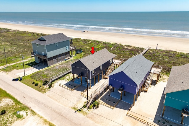 bird's eye view featuring a beach view and a water view