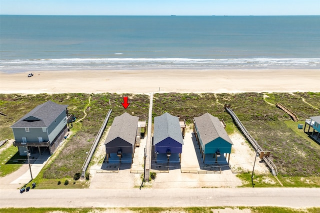 bird's eye view with a water view and a view of the beach