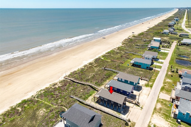 bird's eye view with a beach view and a water view