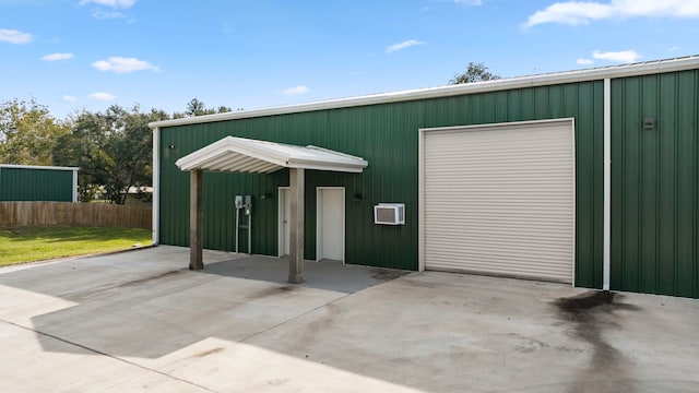 garage with a wall mounted air conditioner