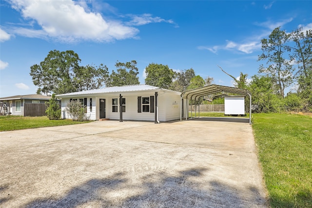 single story home featuring a carport and a front yard