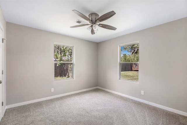 carpeted empty room with ceiling fan