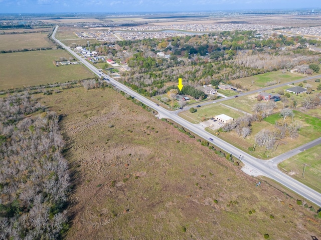 birds eye view of property featuring a rural view