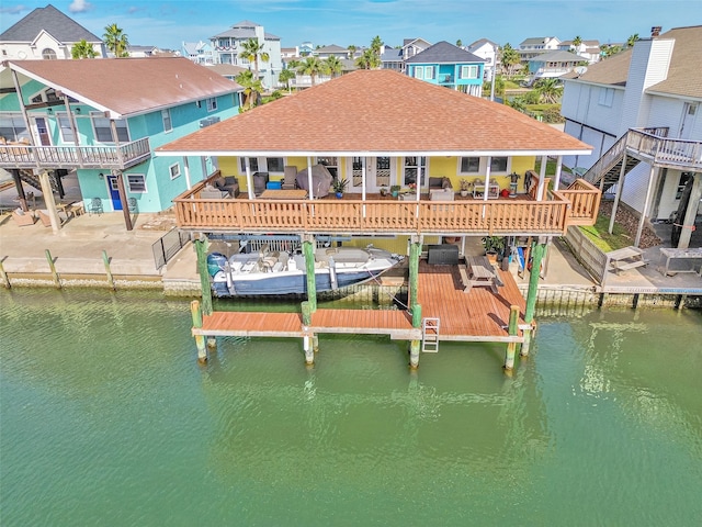 dock area featuring a deck with water view