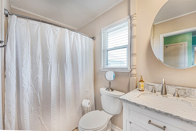 bathroom featuring plenty of natural light, vanity with extensive cabinet space, a textured ceiling, and toilet