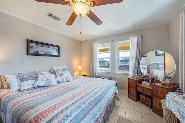 bedroom with crown molding, a textured ceiling, ceiling fan, and light tile floors