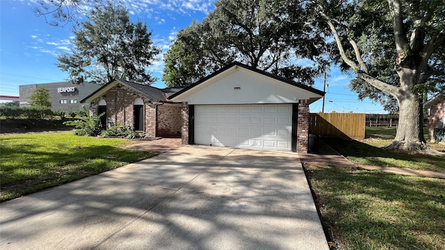 single story home featuring a front yard and a garage