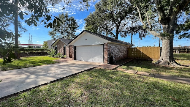 view of front of house with a front lawn and a garage