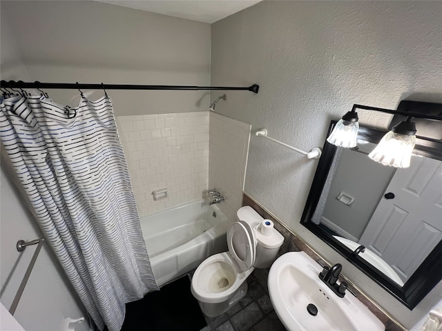 full bathroom featuring sink, toilet, and shower / bath combo