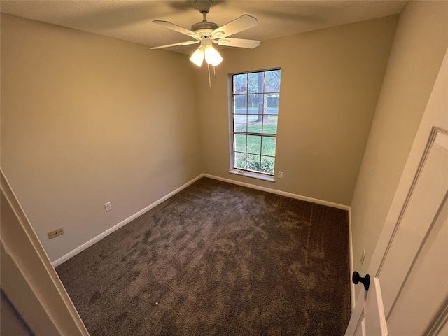 empty room with carpet and ceiling fan