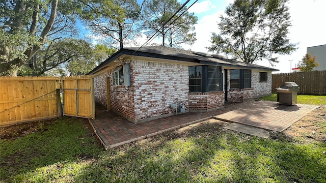 back of property with a patio area