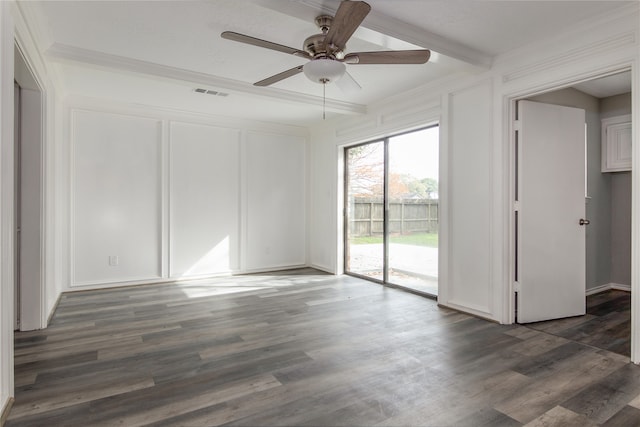 spare room with beam ceiling, dark wood-type flooring, crown molding, and ceiling fan