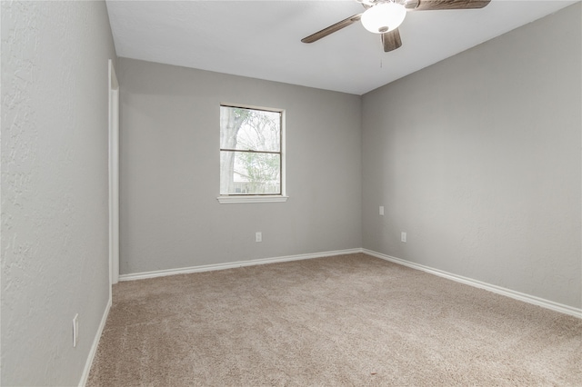 unfurnished room with carpet floors and ceiling fan