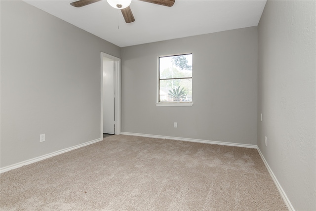 empty room with carpet and ceiling fan