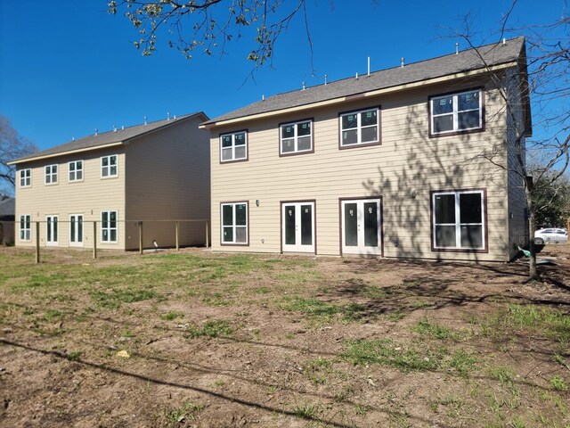 back of property featuring french doors