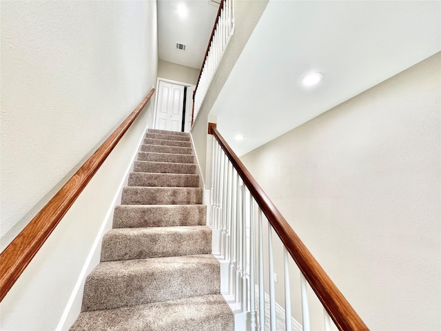 staircase featuring recessed lighting and visible vents