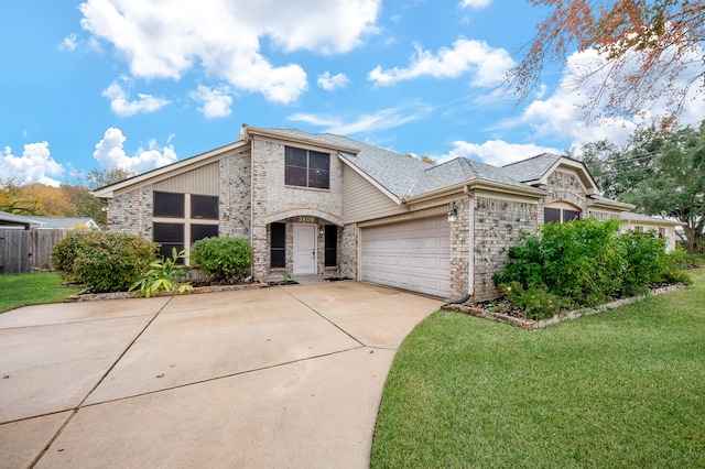 view of front of property featuring a garage and a front lawn