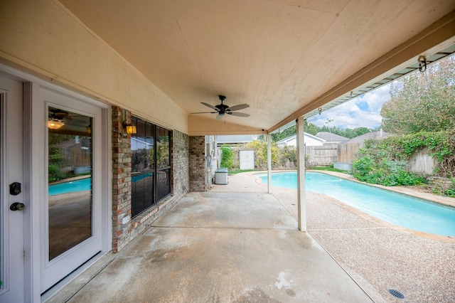 view of pool with ceiling fan and a patio