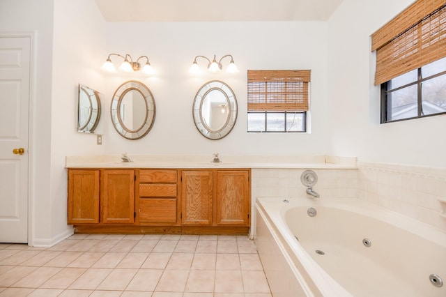 bathroom featuring vanity, tiled tub, and tile patterned floors