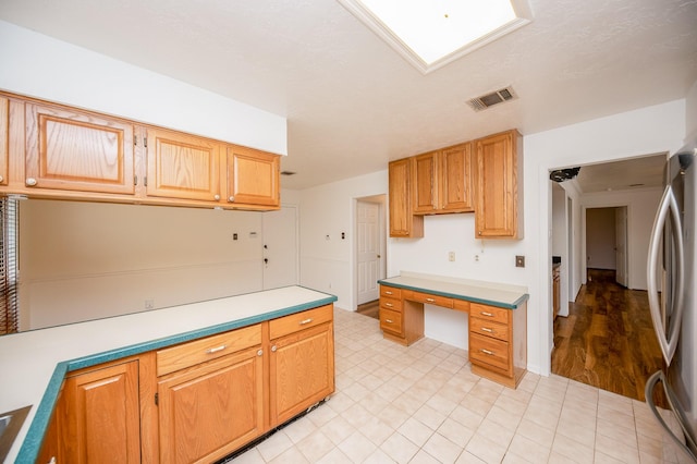 kitchen featuring stainless steel fridge