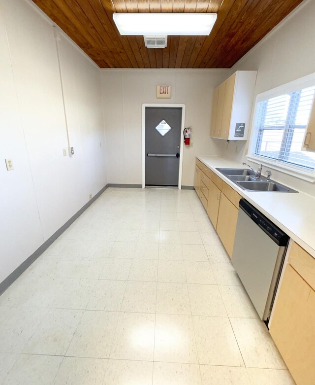 kitchen with light tile patterned floors, dishwasher, sink, and wooden ceiling