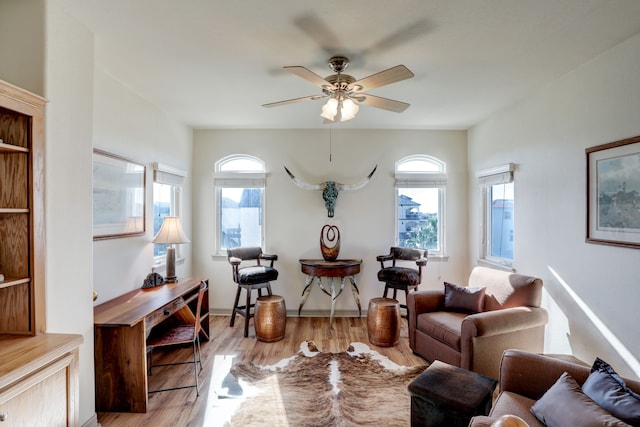 sitting room featuring ceiling fan and light hardwood / wood-style flooring