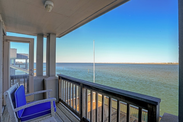 balcony featuring a water view