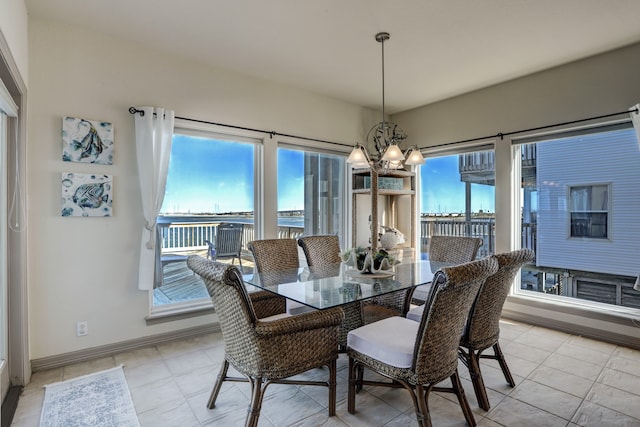 dining area featuring a chandelier and a healthy amount of sunlight