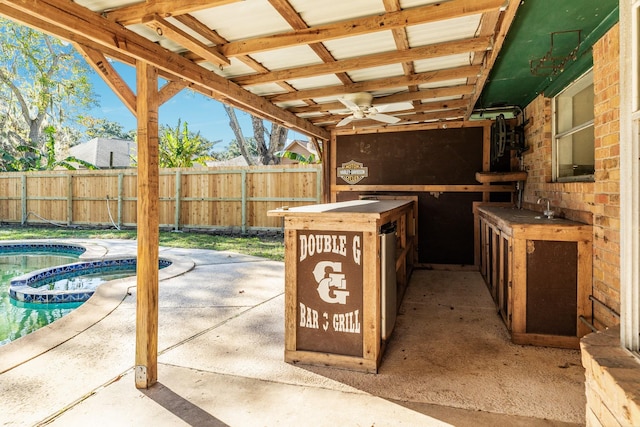 view of patio / terrace with a fenced in pool and ceiling fan