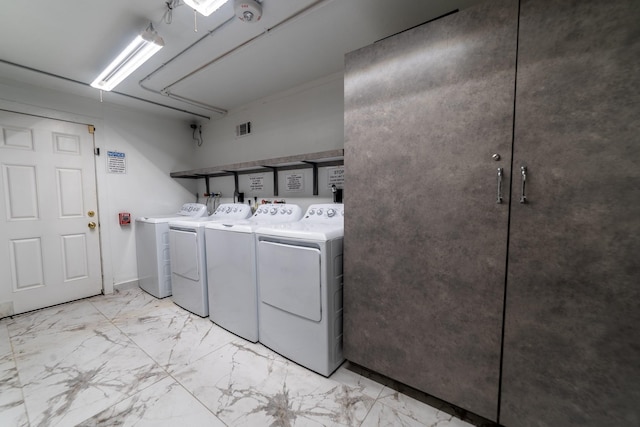 laundry area featuring washing machine and clothes dryer