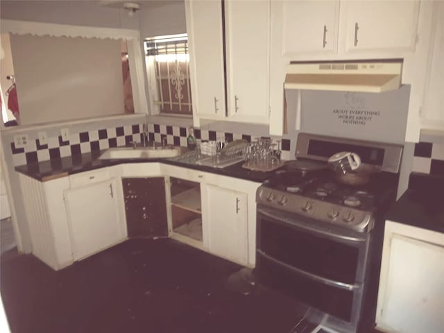 kitchen featuring white cabinets, sink, and stainless steel gas range