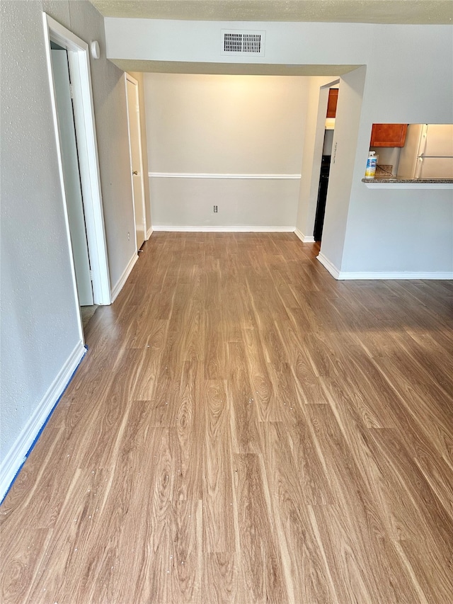 unfurnished room featuring wood-type flooring