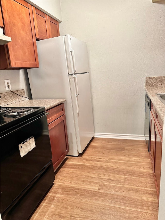 kitchen with light hardwood / wood-style floors and black electric range