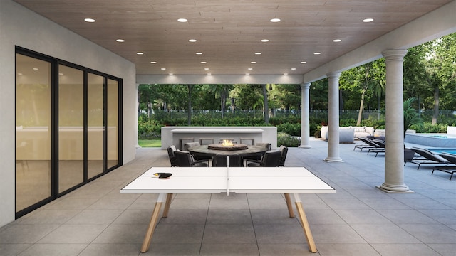 view of patio / terrace featuring an outdoor living space with a fire pit