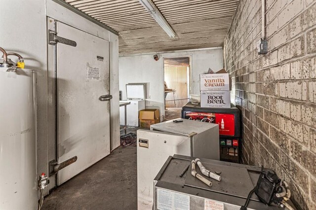 utility room with water heater