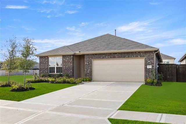 ranch-style home with a garage and a front lawn