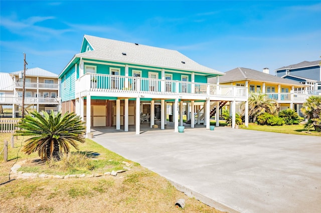 view of front of home with a carport and covered porch