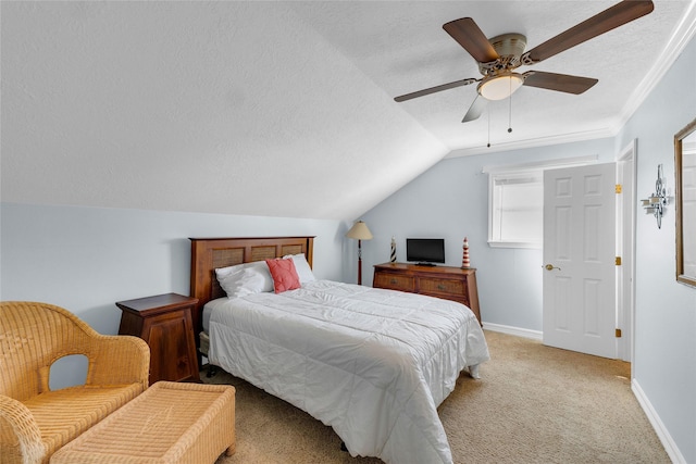 bedroom featuring lofted ceiling, ceiling fan, ornamental molding, a textured ceiling, and light carpet